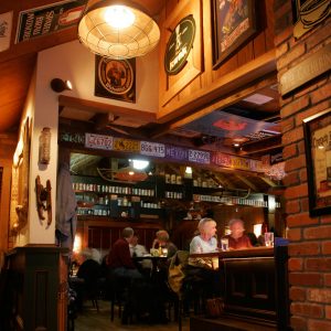 Customers enjoying handcrafted cocktails and wine at the bar