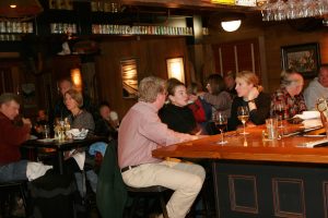 Customers drinking wine at the Tabernash Tavern bar